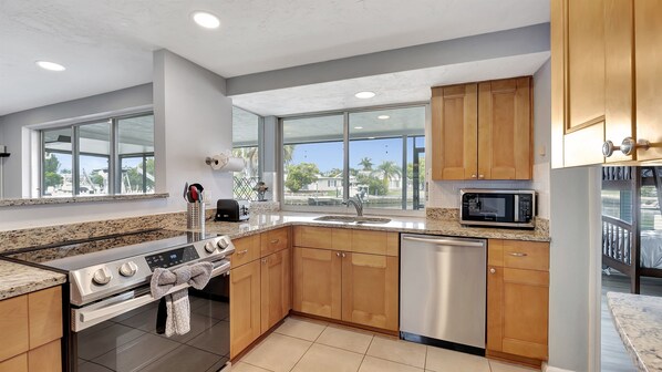 Enjoy cooking in this kitchen with a stainless steel range, dishwasher, and ample counter space.