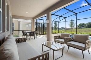 Relax in style with a comfortable seating area, dining space, and expansive views of the surrounding landscape.
