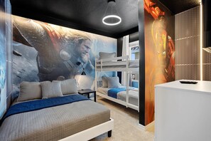 Cozy retreat with a unique wall mural and a comfortable bunk bed arrangement.