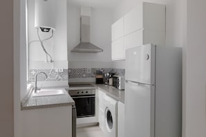 Coffee/tea maker, fridge, microwave, oven