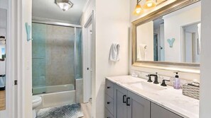 Combined shower/tub, hair dryer, towels, shampoo