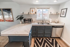 House, Multiple Beds (Cozy Cove Cottage) | Private kitchen | Dining tables - Cozy Cove Cottage (Seaside)