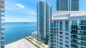 A high-rise hotel with multiple floors, a pool area, and a view of the ocean. - TC-2607 · Bright and cozy 2 bedroom free parking at brickell (Miami)
