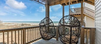 Luxury Beachfront Condo with Covered Deck Steps From Beach & Golf Cart Rental 