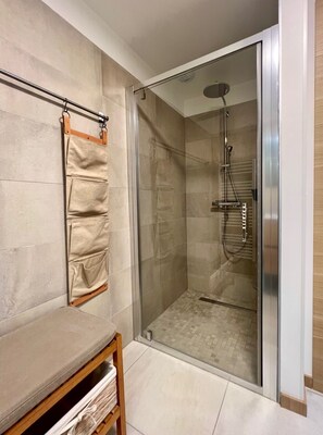 Shower, hair dryer, towels, soap