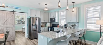 3 Master Bedrooms, 1/2 bath, 3 Pools, Hot Tub, Screened Porches w/epic Swings