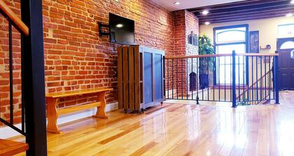 Exclusive Sunken Living Room Soaring Exposed Brick