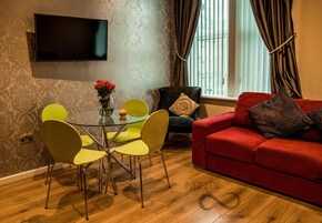 Business Apartment, 1 Bedroom, City View | Living area | 40-inch flat-screen TV with digital channels, TV