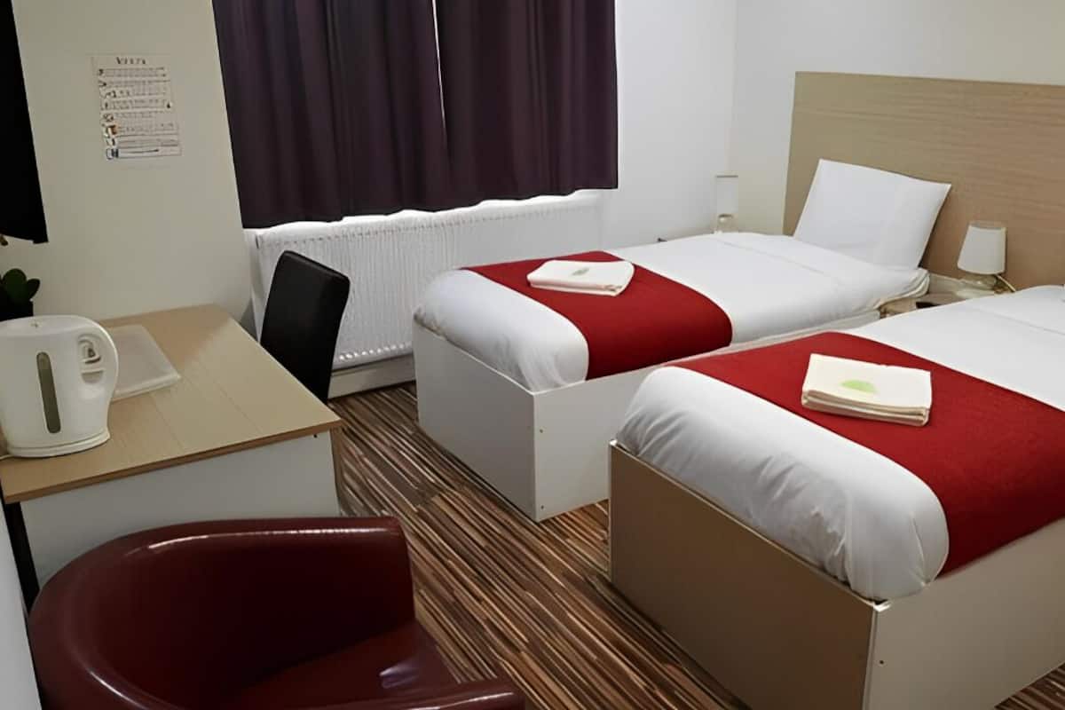 Standard Twin Room, 2 Single Beds | Individually furnished, desk, laptop workspace, free WiFi