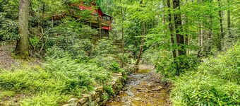 Creekside mountain cabin with firepit, deck, grill, Ping-Pong, and fireplace