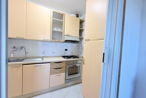 Fridge, oven, dining tables