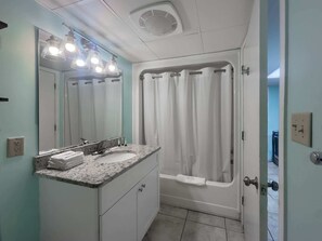 Combined shower/tub, hair dryer, towels, shampoo