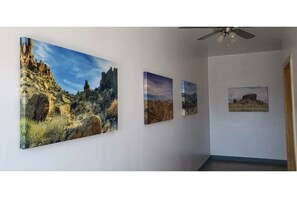 Stunning hallway with beautiful landscape paintings adorning the walls.