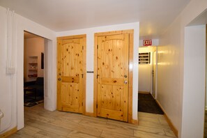 Enter a tranquil space with a hallway leading to a cozy room.