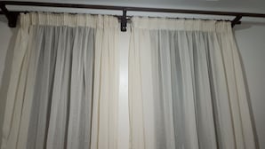 A room with a large window covered by sheer white curtains. - Cozy b n' b in Bunga (Kampala)