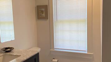Combined shower/tub, hair dryer, towels, soap