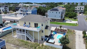 A two-story house with a balcony, a swimming pool, and a hot tub. - Oceanside, Private Pool, Close to the beach! OS1F, La Maison de la Mer (Corolla)