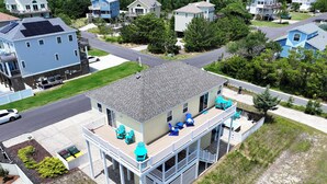 A two-story house with a balcony, a pool, and a garage. - Oceanside, Private Pool, Close to the beach! OS1F, La Maison de la Mer (Corolla)