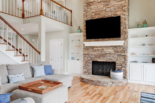 Stunning lakefront home with kayaks, dock, fireplace, game room, & washer/dryer