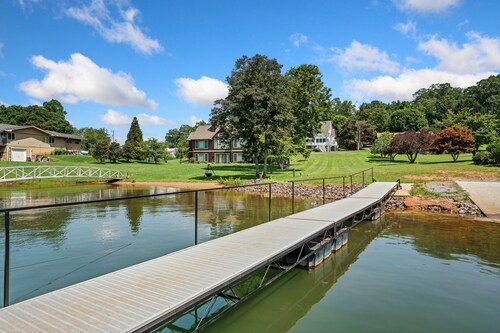 Stunning lakefront home with kayaks, dock, fireplace, game room, & washer/dryer