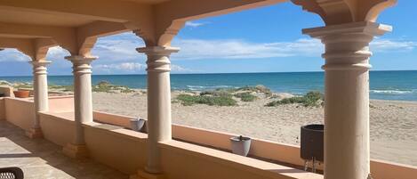 On the beach, sun-loungers, beach towels