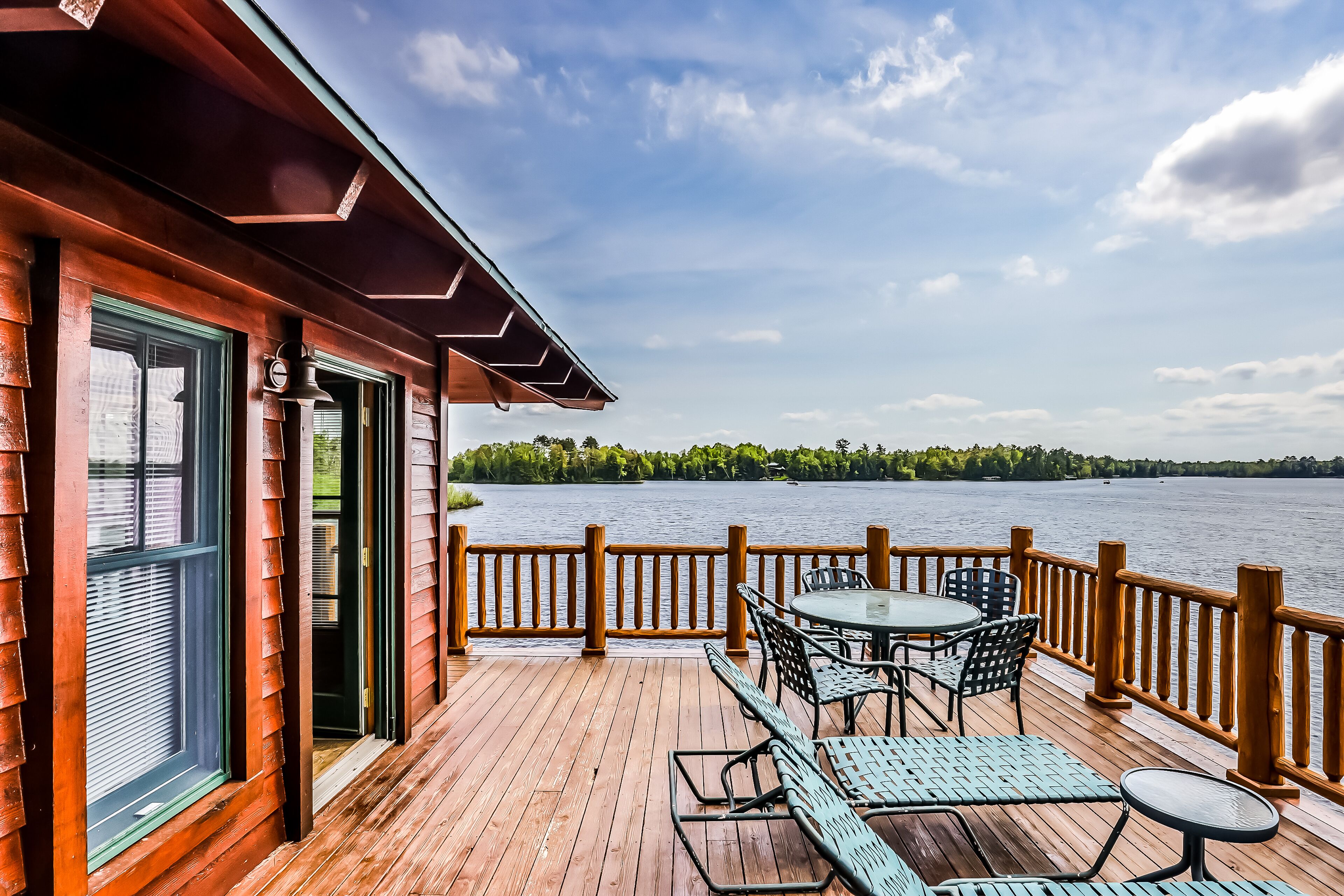 Lakefront home with large deck, gas grill, wood fireplace, heated pool, firepit
