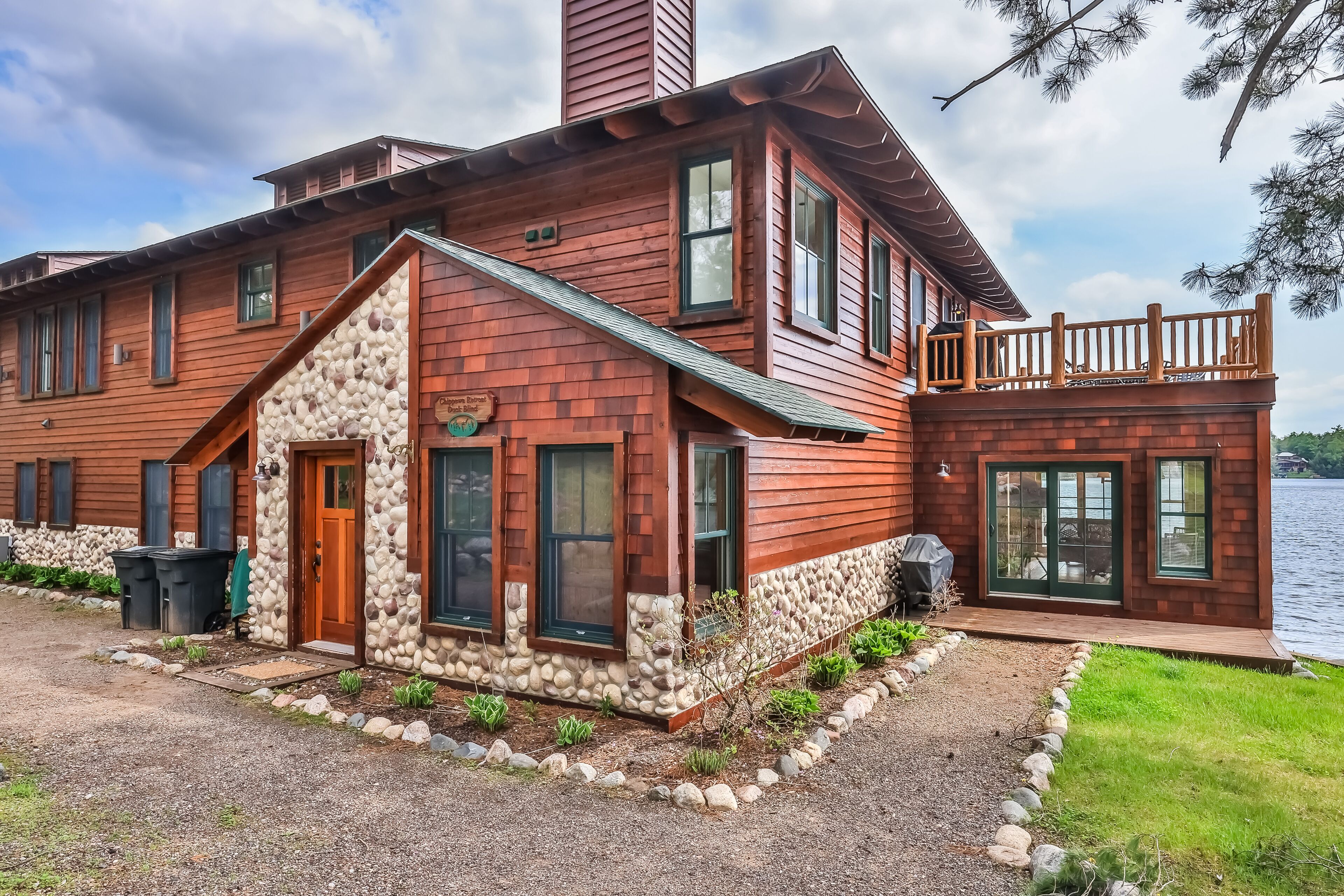 Waterfront resort condo with private dock, 4-season porch, & seasonal pool