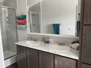 Shower, hair dryer, towels, soap