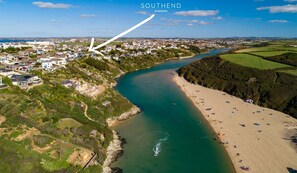 An aerial view of Southend with a river, beach, and residential area.