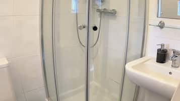 Shower, towels, soap, toilet paper
