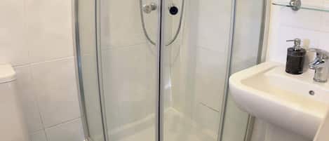 Shower, towels, soap, toilet paper