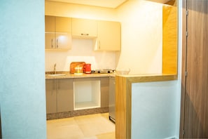 Apartment, 1 King Bed with Sofa bed | Private kitchen | Fridge, microwave, oven, stovetop