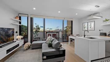 Superior Apartment | Living area | 50-inch Smart TV with digital channels, TV, Netflix