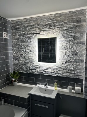 Combined shower/tub, hair dryer, towels, toilet paper