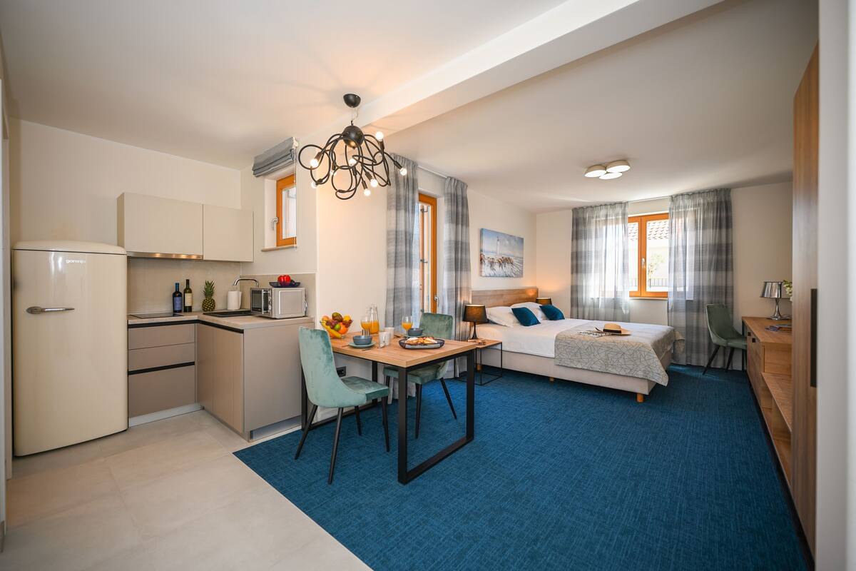 Classic Apartment, 1 Bedroom, Pool View | Desk, iron/ironing board, WiFi (free), bed sheets