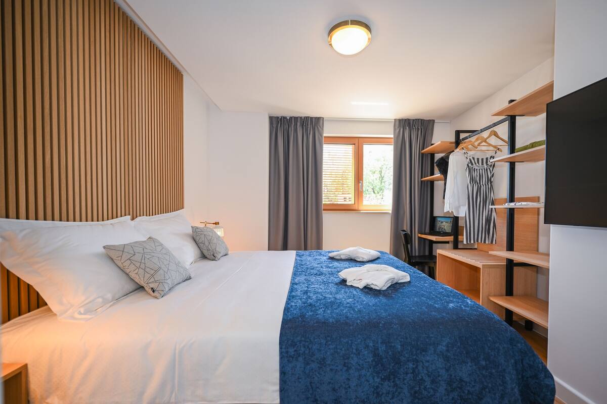 Grand Apartment, 1 Bedroom, Courtyard View | Desk, iron/ironing board, WiFi (free), bed sheets