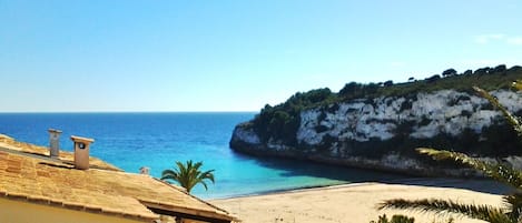 On the beach, sun-loungers