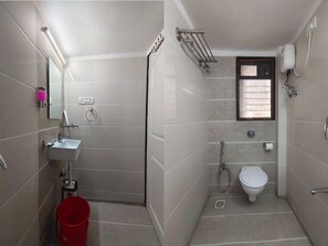 Deluxe Room | Bathroom | Shower, rainfall showerhead, designer toiletries, bidet - Astha Residency (Mumbai)