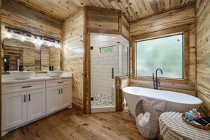 Bathtub, hair dryer, towels, toilet paper