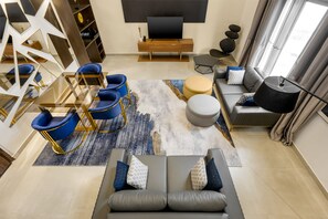 Family Suite | Living area | 50-inch Smart TV with satellite channels, TV