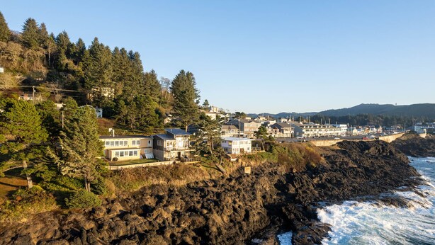 A coastal town with houses on a cliff overlooking the ocean. - Ocean Front Condo! Spectacular Ocean Views!  Walk to Everything! (Depoe Bay)