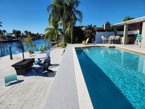 Outdoor lovers dream home- Pool, outdoor kitchen, private dock, and so much more