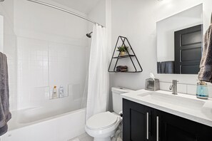 Combined shower/bathtub, hair dryer, towels, soap