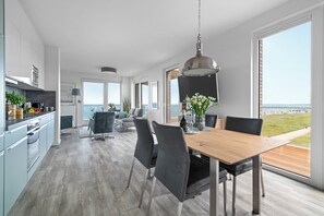 Dining - "BeachViewFour": Holiday apartment right on the beach with sauna, balcony & Baltic Sea view (Olpenitz)