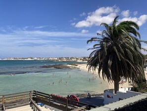 On the beach, beach towels - Beautiful Beachfront APTMTO at waters edge with stunning Ocean and Harbour views (Corralejo)