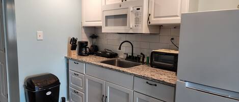 Fridge, microwave, coffee/tea maker, toaster