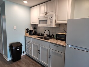 Fridge, microwave, coffee/tea maker, toaster - Harrison Hotel Unit G2 Pet Friendly STEEP STAIRS! 3rd story Studio apartment.
(Garden City)