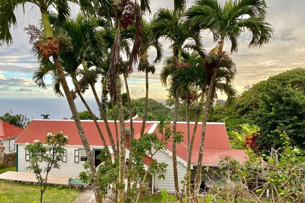 View from behind house with Caribbean Sea in background.