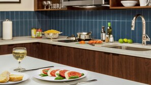 A kitchen with a white countertop, a sink, and various kitchen items. - Staybridge Suites Lexington S Medical Ctr Area (Lexington)
