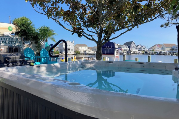 Soak in the view—your private hot tub retreat just steps from the lagoon 🌿🛁☀️”